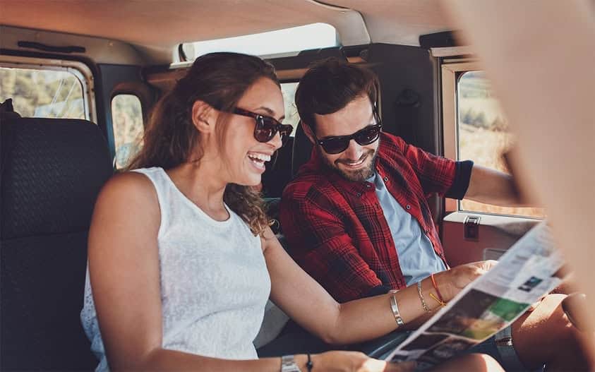 Couple traveling by car