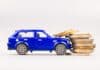 Toy car collides with fees, source: Shutterstock