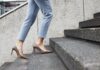 Businesswoman going up stairs, source: Shutterstock