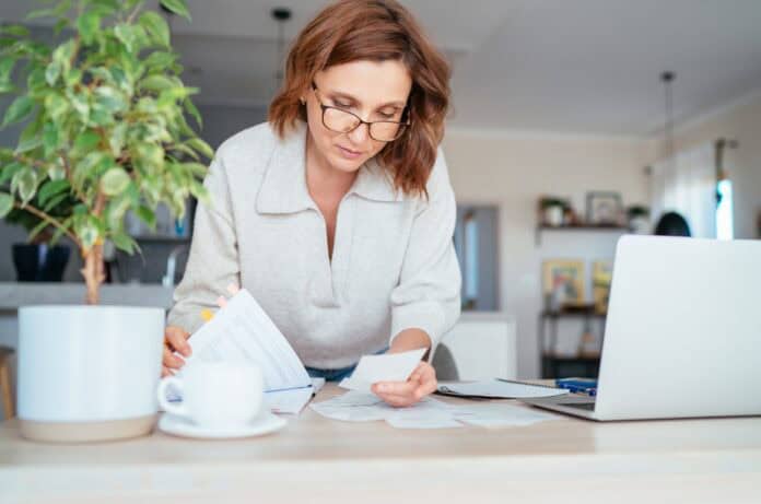 Owner of small business checking documents, source: Shutterstock