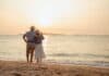 Happy retired couple at the beach, source: Shutterstock