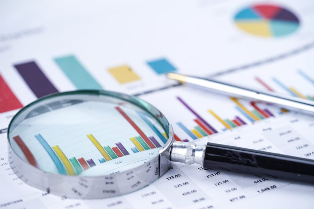 magnifying glass on statistics, source: Shutterstock