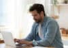 Man at laptop, submitting online application, source: Shutterstock