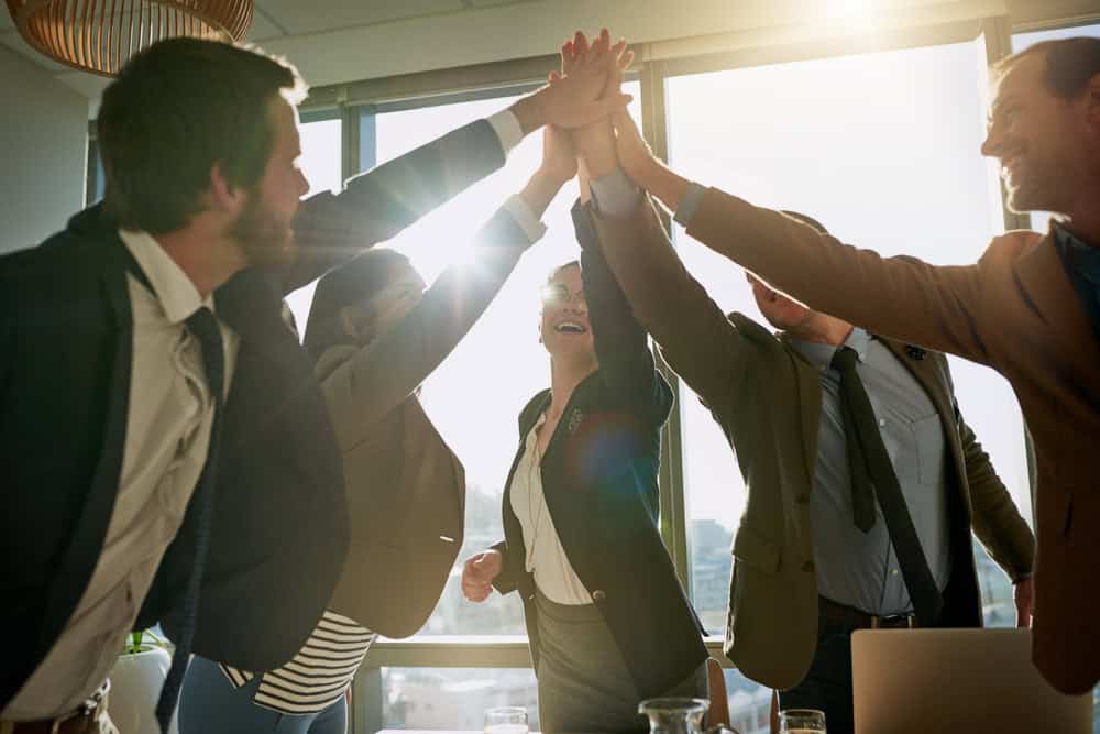 Office celebration scene, source: Shutterstock