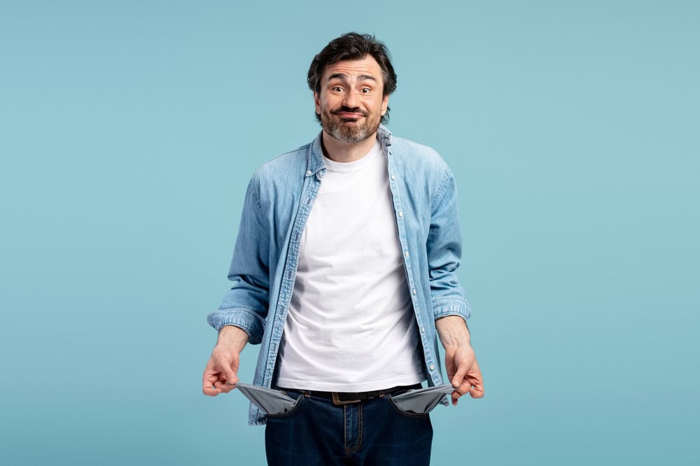 Man with empty pockets, source: Shutterstock