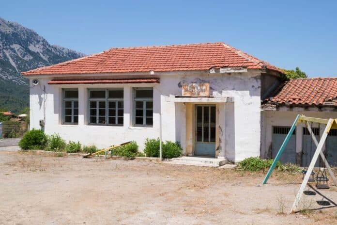 North,Evia,,Greece,-,June,27th,2024,-,The,Abandoned The abandoned elementary school building in Vlachia village, North Evia, Greece, source: kokixx / Shutterstock.com