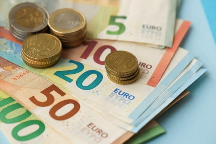 Euro banknotes and coins, source: Shutterstock