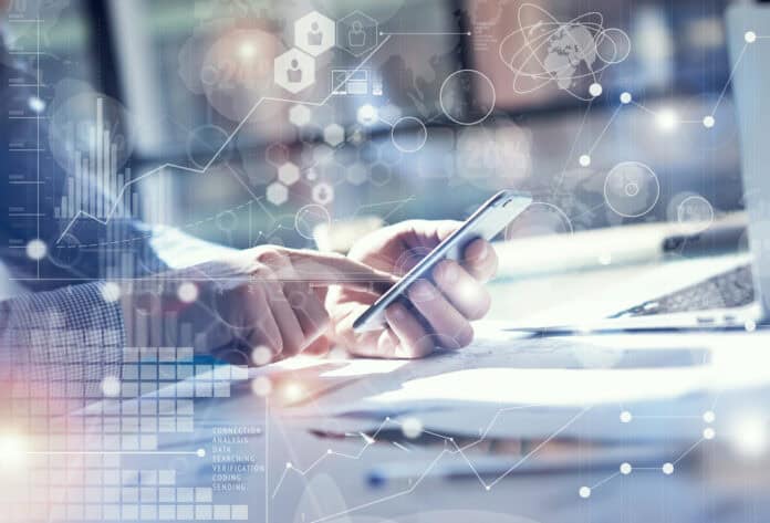 Digital opportunity concept, man with smartphone and laptop, source: Shutterstock