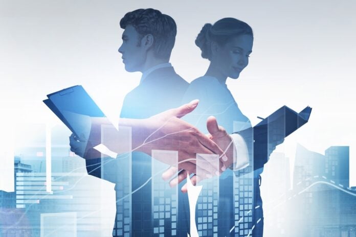 Businessman,Wearing,Formal,Suit,Is,Shaking,Hands,With,Businesswoman,And Business deal concept, source: Shutterstock