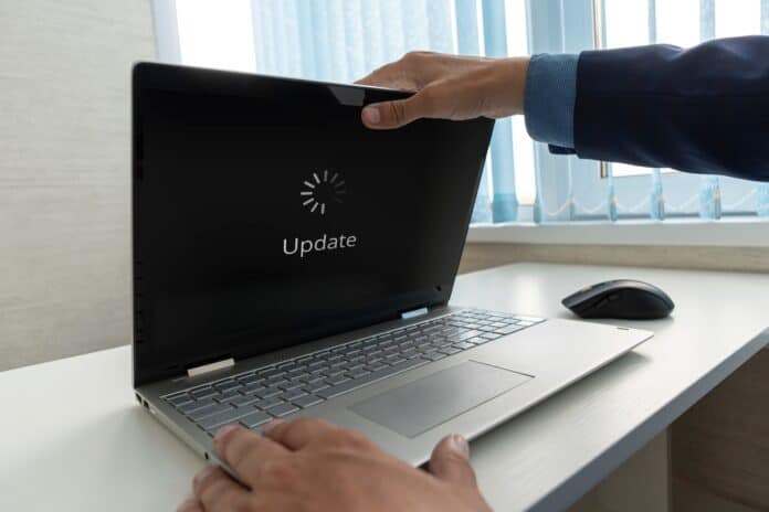 Updating,Software,Technology,Upgrade,Concept.,A,Businessman,Opens,A,Modern Laptop updating, source: Shutterstock