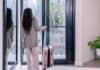 Tourist with suitcase in rented appartment, source: Shutterstock