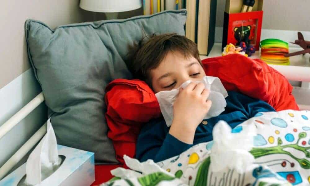 Sick child in bed