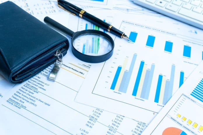 Business,Report,Statement,For,Analysis,And,Review,Market,Share,And Statistics, magnifying glass and wallet, source: Shutterstock