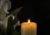 Death concept with candle, source: Shutterstock