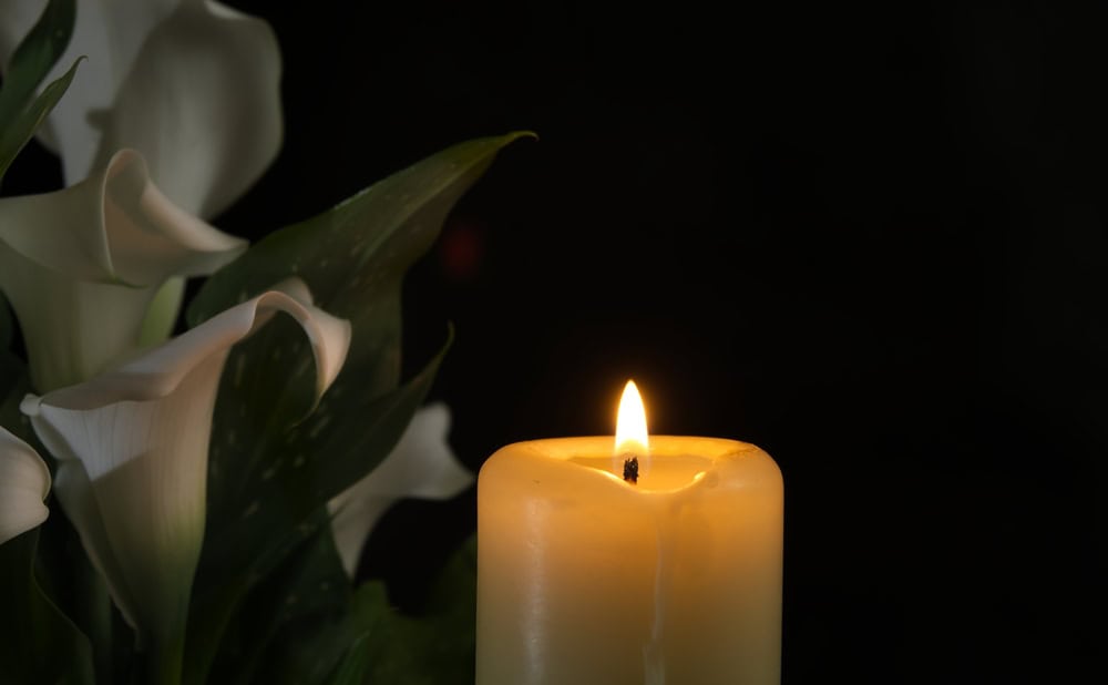 Death concept with candle, source: Shutterstock