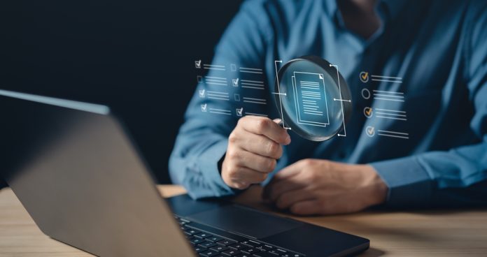 Insurance magnifying glass concept, source: Shutterstock