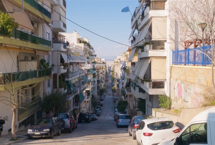 View,Down,A,Typical,Steep,Car,Lined,Residential,Street,In Greek cars, view down a typical steep car lined residential street in Athens Greece, source: Shutterstock