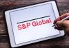 Logo of S and P Global Inc. on tablet, source: Shutterstock