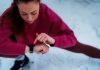 Winter fitness in snow, woman with fitness tracker, source: Shutterstock