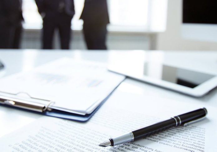 close-up-pen-financial-report-1 Insurance meeting, source: infotrust