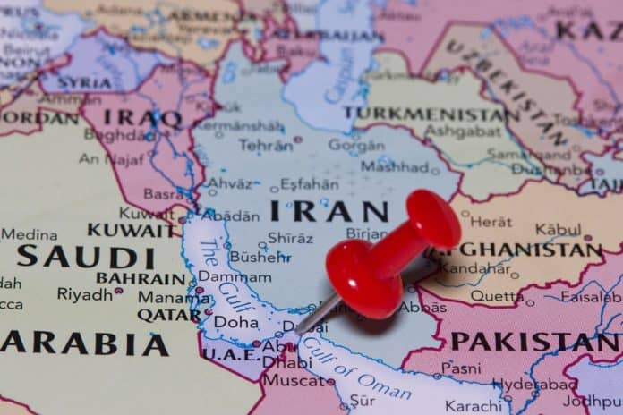 The Strait of Hormuz, the Gulf of Oman, and Iran pinned on a political map, source: Below the Sky / Shutterstock.com