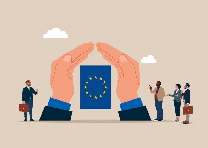 European insurance and HR, illustration with hands around EU flag and employees, source: Shutterstock
