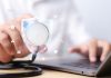 Health Insurance concept, doctor on laptop, source: Shutterstock