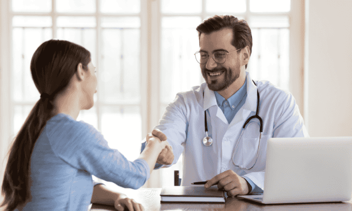 Doctor shakes hands with patient