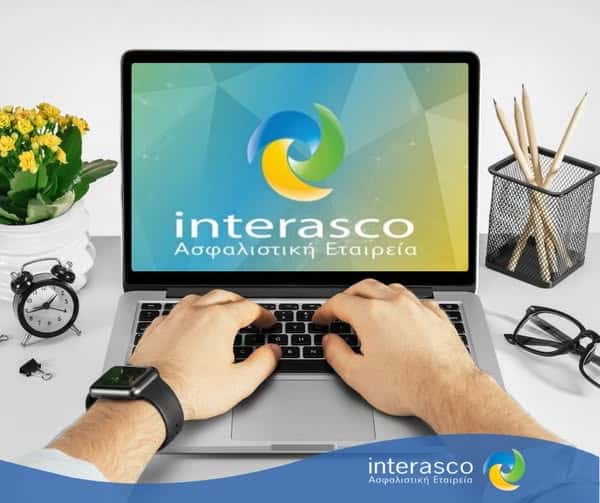 Interasco, εικαστικό με σκηνή γραφείου, χέρια σε λάπτοπ, για την πλατφόρμα My Interasco