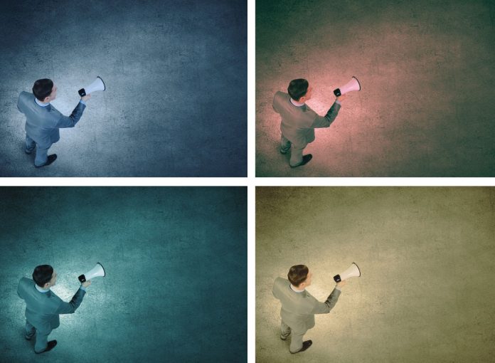 Man with bullhorn in the dark, pop art collage with Shutterstock image