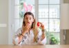 Surprised woman with bunny ears and easter egg, source: Shutterstock