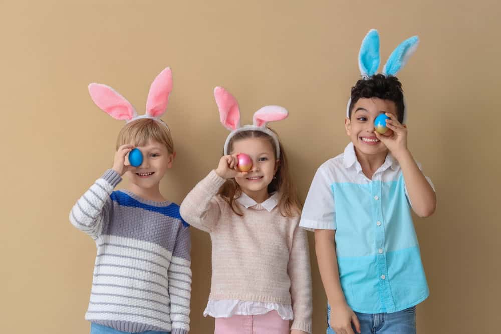 Easter, kids with bunny ears and eggs, source: Shutterstock