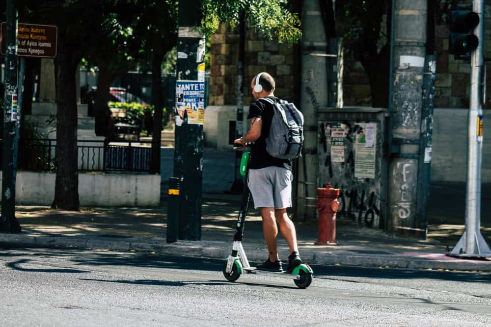 Man on electric scooter, Athens, source: Shutterstock