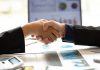 Handshake and statistics, deal concept, source: Shutterstock