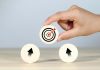 Αction plan, hand with target and arrows icons on wooden circles, source: Shutterstock