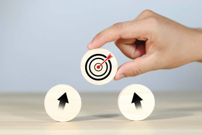 Αction plan, hand with target and arrows icons on wooden circles, source: Shutterstock