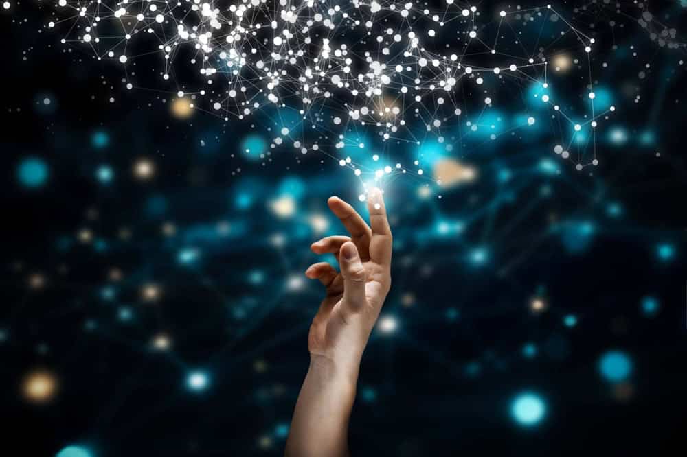 Human and technology concept with hand and cloud of lights, source: Shutterstock