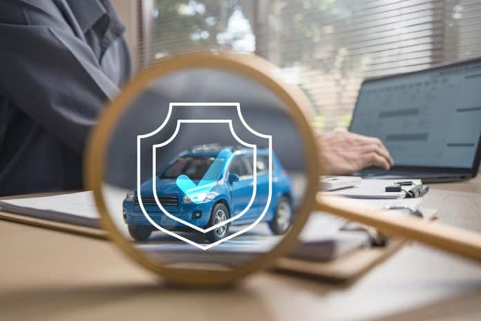 Car safety concept, man at laptop and blue car with insurance sign and magnifying glass, source: Shutterstock