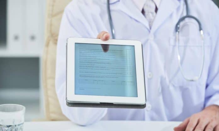 Digital health, doctor giving tablet