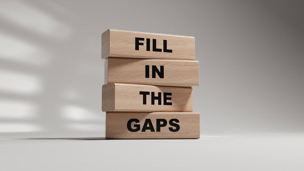 Wooden block with fill in the gaps message, source: Shuterstock