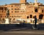 man on electric scooter between roman monuments, source: Shutterstock