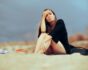 Unhappy woman at the beach, source: Shutterstock