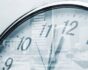 Time concept, clock and corporate buildings, source: Shutterstock