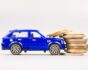Toy car collides with fees, source: Shutterstock