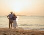 Happy retired couple at the beach, source: Shutterstock