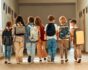 Children with schoolbags at school, source: Shutterstock
