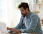 Man at laptop, submitting online application, source: Shutterstock