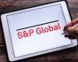 Logo of S and P Global Inc. on tablet, source: Shutterstock