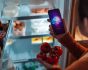 EY, AI report cover image, woman with smartphone and tomatoes standing at the fridge