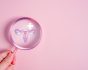 Gynaecology concept, vagina and pink magnifying glass
